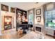Sunlit piano room featuring elegant furnishings, a fireplace, and lots of natural light at 51 Norton Ave, Acworth, GA 30101