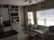 Inviting living room with a comfortable sofa, built-in shelving, and a large window providing natural light at 51 Norton Ave, Acworth, GA 30101