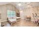 Living room with vaulted ceilings, unique wallpaper, and natural light from a large window at 51 Norton Ave, Acworth, GA 30101