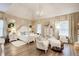Bright main bedroom featuring a chandelier, sitting area, and ensuite bathroom at 51 Norton Ave, Acworth, GA 30101
