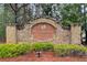 Stone sign marking the entrance to Westbrook Creek, enhanced with lush landscaping at 51 Norton Ave, Acworth, GA 30101