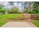 Expansive backyard with lush green grass and mature trees at 6351 Stablewood Way, Lithonia, GA 30058
