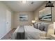 Comfortable bedroom featuring neutral walls, plush bedding, and decorative artwork at 6351 Stablewood Way, Lithonia, GA 30058