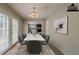 Dining area with French doors, chandelier and marble dining table at 6351 Stablewood Way, Lithonia, GA 30058