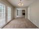 The dining area features French doors and a view into the living room fireplace at 6351 Stablewood Way, Lithonia, GA 30058