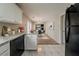 Bright kitchen featuring granite countertops, white cabinets, and stainless steel dishwasher at 6351 Stablewood Way, Lithonia, GA 30058