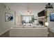 Staged living room with stone fireplace, ceiling fan, and comfortable seating at 6351 Stablewood Way, Lithonia, GA 30058