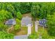 Aerial view of the property in a neighborhood with mature trees at 9691 Squirrel Wood Run, Douglasville, GA 30135