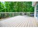 Spacious back deck perfect for outdoor entertaining and relaxation, surrounded by lush greenery at 9691 Squirrel Wood Run, Douglasville, GA 30135