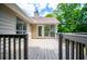 Back of house with deck overlooking backyard area at 9691 Squirrel Wood Run, Douglasville, GA 30135