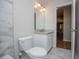 Clean bathroom with tub and toilet and sink area at 9691 Squirrel Wood Run, Douglasville, GA 30135