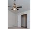 Bright bedroom featuring a vaulted ceiling, ceiling fan, neutral carpet and dual closets at 9691 Squirrel Wood Run, Douglasville, GA 30135