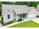 Charming single-story home featuring an attached garage, landscaped yard, and covered entry at 9691 Squirrel Wood Run, Douglasville, GA 30135