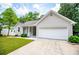 Charming single-story home featuring an attached garage, manicured lawn, and inviting curb appeal at 9691 Squirrel Wood Run, Douglasville, GA 30135