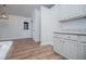 Kitchen offers new cabinets, countertops, appliances, and a door leading to the backyard at 9691 Squirrel Wood Run, Douglasville, GA 30135