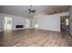 Bright, open living room with vaulted ceiling, modern fireplace, and wood-look flooring at 9691 Squirrel Wood Run, Douglasville, GA 30135