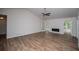 Bright, open living room with vaulted ceiling, modern fireplace, and wood-look flooring at 9691 Squirrel Wood Run, Douglasville, GA 30135