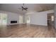 Bright, open living room with vaulted ceiling, modern fireplace, and wood-look flooring at 9691 Squirrel Wood Run, Douglasville, GA 30135