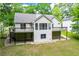 Rear exterior featuring a patio and deck offering a great space for relaxing and entertaining outdoors at 9691 Squirrel Wood Run, Douglasville, GA 30135