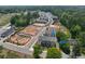New construction homes feature modern exteriors and landscaping; neighborhood surrounded by mature trees at 1932 Appian Aly, Kennesaw, GA 30144