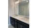 Elegant bathroom features dual sinks with modern fixtures, a large mirror, and dark cabinetry at 1932 Appian Aly, Kennesaw, GA 30144