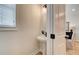 Stylish powder room with a pedestal sink and modern fixtures at 1932 Appian Aly, Kennesaw, GA 30144