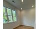 Bedroom features a window bringing in natural light and a hardwood floor at 1932 Appian Aly, Kennesaw, GA 30144