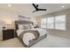 Bedroom with soft, neutral colors, a large bed with a tufted headboard, and a ceiling fan at 1932 Appian Aly, Kennesaw, GA 30144