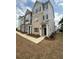 Multi-story building showcasing brick and siding facade with manicured landscaping at 1932 Appian Aly, Kennesaw, GA 30144