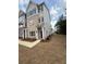 New construction exterior with stone and siding, with a covered front entryway and landscaping at 1932 Appian Aly, Kennesaw, GA 30144