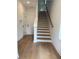 Bright foyer with hardwood floors and stairs leading to the upper level at 1932 Appian Aly, Kennesaw, GA 30144