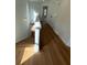 Hallway with wood floors and a staircase at 1932 Appian Aly, Kennesaw, GA 30144
