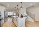 Open concept kitchen features a large island, stainless appliances, and seamless living area access at 1932 Appian Aly, Kennesaw, GA 30144