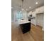 Modern kitchen with a large center island, stainless steel appliances, and ample cabinetry at 1932 Appian Aly, Kennesaw, GA 30144