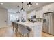 Well-equipped kitchen featuring stainless steel appliances, white cabinets and pendant lighting at 1932 Appian Aly, Kennesaw, GA 30144