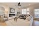 Stylishly furnished living room with a fireplace and ample natural light at 1932 Appian Aly, Kennesaw, GA 30144