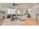 Bright living room featuring neutral decor, ceiling fan, natural light, and elegant furnishings at 1932 Appian Aly, Kennesaw, GA 30144