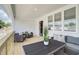 Covered porch area with cozy seating, stylish decor, and charming details at 1932 Appian Aly, Kennesaw, GA 30144