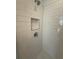 Bright shower features white subway tile, modern fixtures and built-in niche at 1932 Appian Aly, Kennesaw, GA 30144
