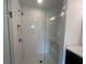 Modern bathroom with frameless glass shower, white subway tiles, and built-in niche at 1932 Appian Aly, Kennesaw, GA 30144