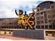 The mascot stands in front of Kennesaw State University's student center at 1932 Appian Aly, Kennesaw, GA 30144