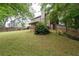 Spacious backyard with a screened porch and a wooden fence at 238 Ivy Glen Cir, Avondale Estates, GA 30002