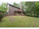 Expansive backyard view features a screened porch and lush green lawn at 238 Ivy Glen Cir, Avondale Estates, GA 30002