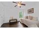 Bedroom with wood floors featuring a ceiling fan, a window, and neutral decor at 238 Ivy Glen Cir, Avondale Estates, GA 30002
