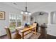 Dining room with views to other living areas featuring white trim and hardwood floors at 238 Ivy Glen Cir, Avondale Estates, GA 30002