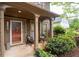 Inviting front porch with decorative columns and well-maintained landscaping at 238 Ivy Glen Cir, Avondale Estates, GA 30002