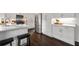 Modern kitchen with white cabinets, stainless steel appliances, breakfast bar, and white countertops at 238 Ivy Glen Cir, Avondale Estates, GA 30002
