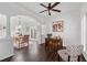 Living room with hardwood floors and a large arched entryway to dining room at 238 Ivy Glen Cir, Avondale Estates, GA 30002
