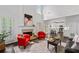 Bright living room with fireplace, two-story ceiling, hardwood floors and an open floor plan to the kitchen at 238 Ivy Glen Cir, Avondale Estates, GA 30002