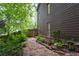 Charming stone pathway and garden lining the side of the home at 238 Ivy Glen Cir, Avondale Estates, GA 30002